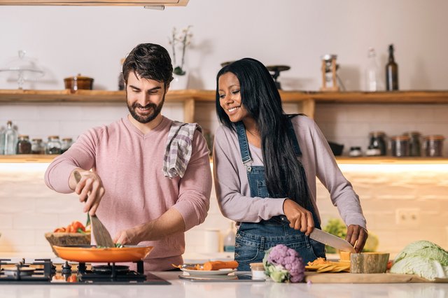 Happy Couple Cooking at Home